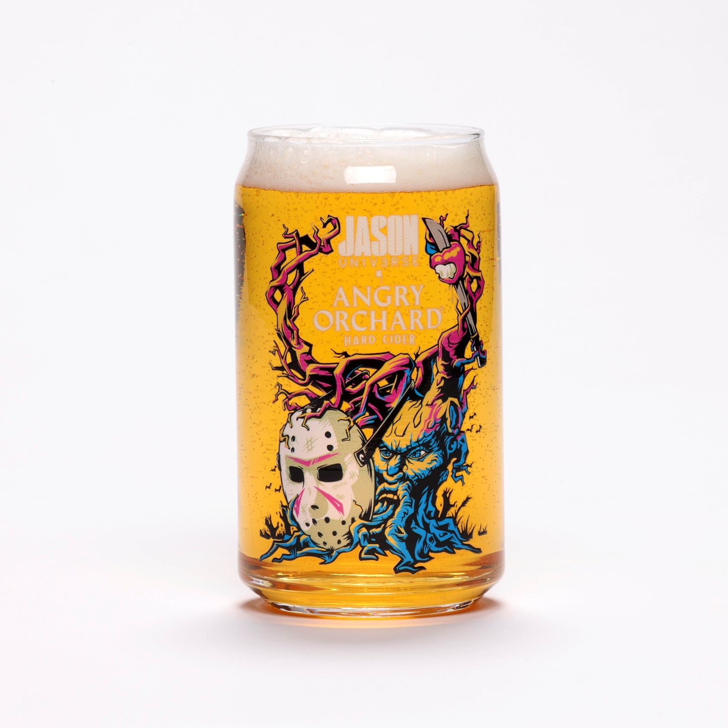 View of one of the glasses featuring colorful Angry Tree capturing Jason Universe mask alone with writing "Jason Universe x Angry Orchard Hard Cider".
