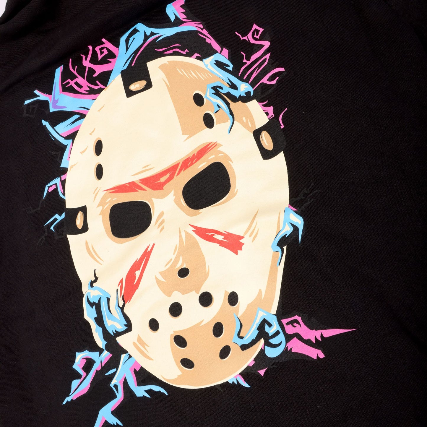 Close-up of black of hoodie which features blue and purple branches enwrapping Jason Universe mask.