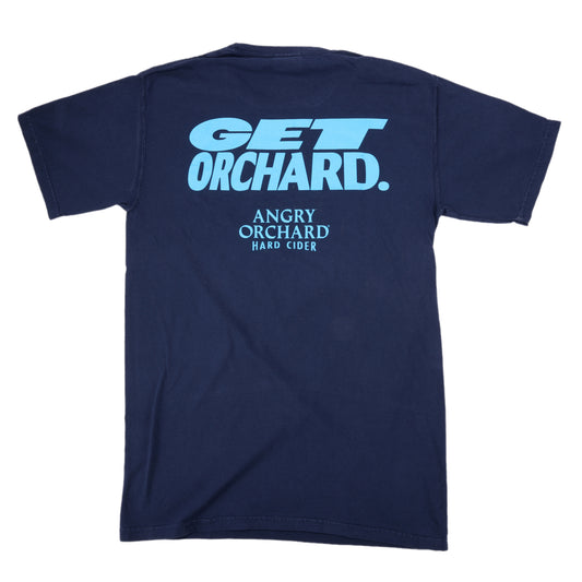 Back view of navy tee, features writing "Get Orchard." and "Angry Orchard Hard Cider" below it in light blue.