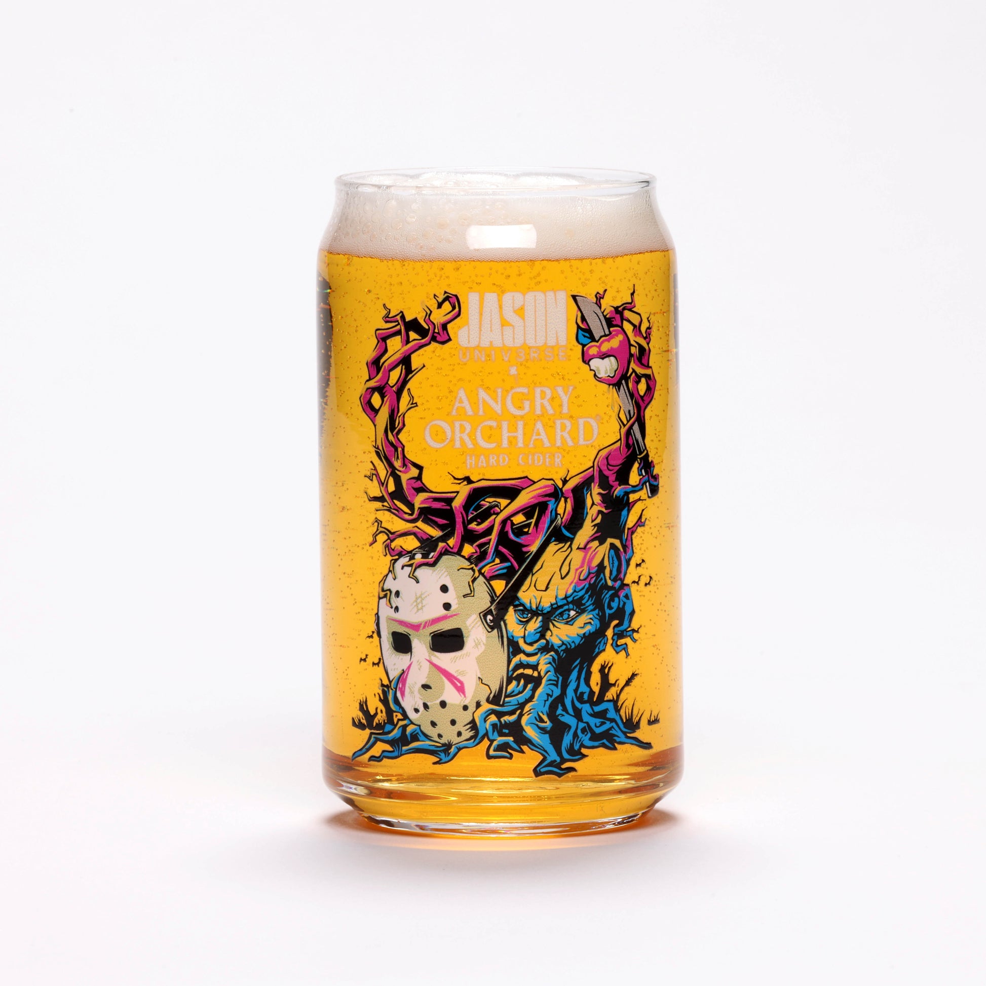 View of one of the glasses featuring colorful Angry Tree capturing Jason Universe mask alone with writing "Jason Universe x Angry Orchard Hard Cider".