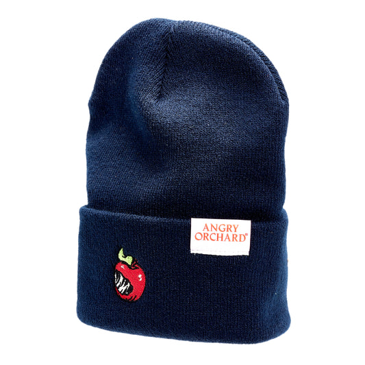 Navy beanie with red bitten apple on fold over. White Angry Orchard tag on the left side of fold over.